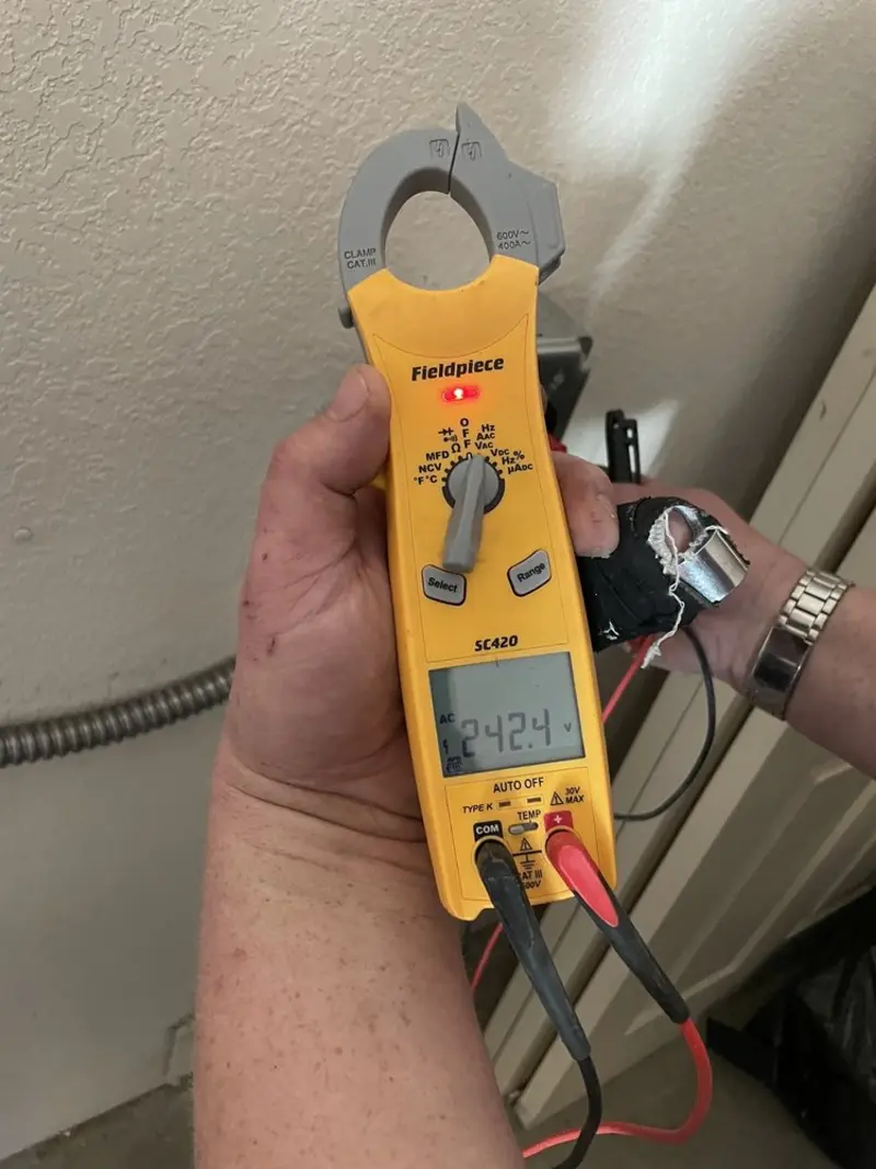 Voltage testing with clamp meter during Recessed Lighting Installation in Northchase